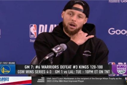 Curry’s post-match interview hat and clothes have the words “winning normal/chasing champion” respectively.